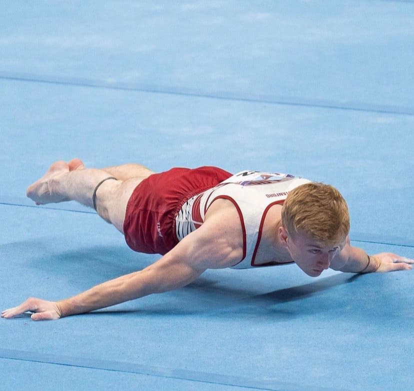 Riley Loos performing a maltese on floor